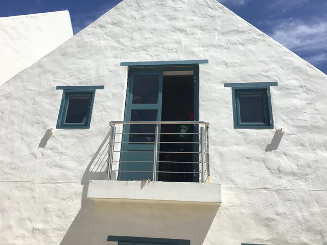 Aluminium balcony door with a glass balustrade