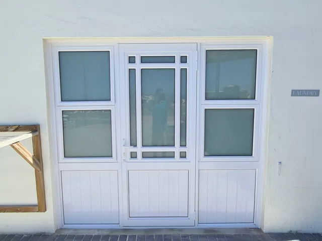Clip 44 hinged door with sidelights, Struisbaai