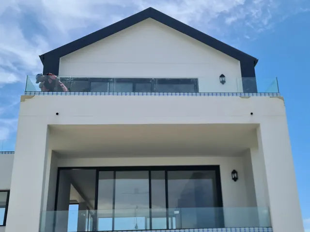 Palace sliding door and frameless glass balustrade, Struisbaai