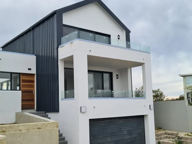 Palace sliding doors, casement windows and frameless balustrades, Struisbaai