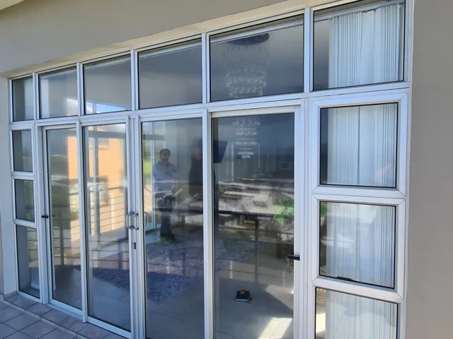 Palace sliding door with sidelights and casement window, Struisbaai