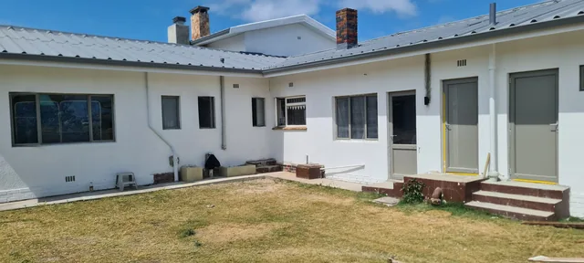 Grey aluminium windows and doors on a white home