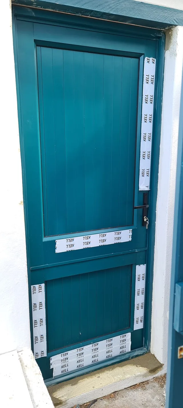 Teal stable-style aluminium door