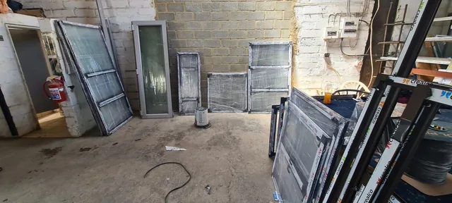 Aluminium frames grouped beside a workshop bench